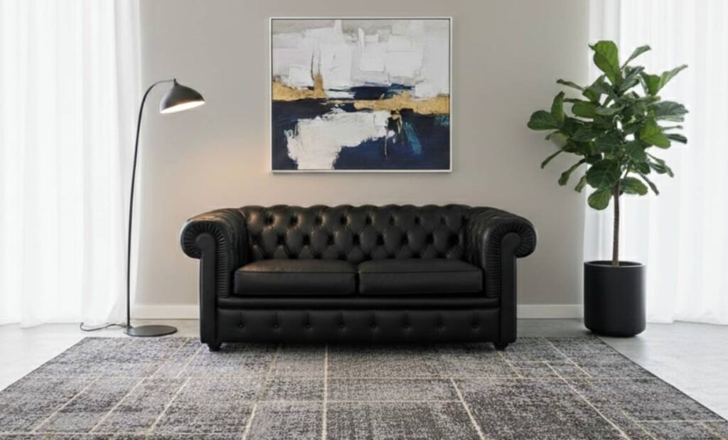 Divano Chester due posti in pelle fiore nera in promozione da Tino Mariani